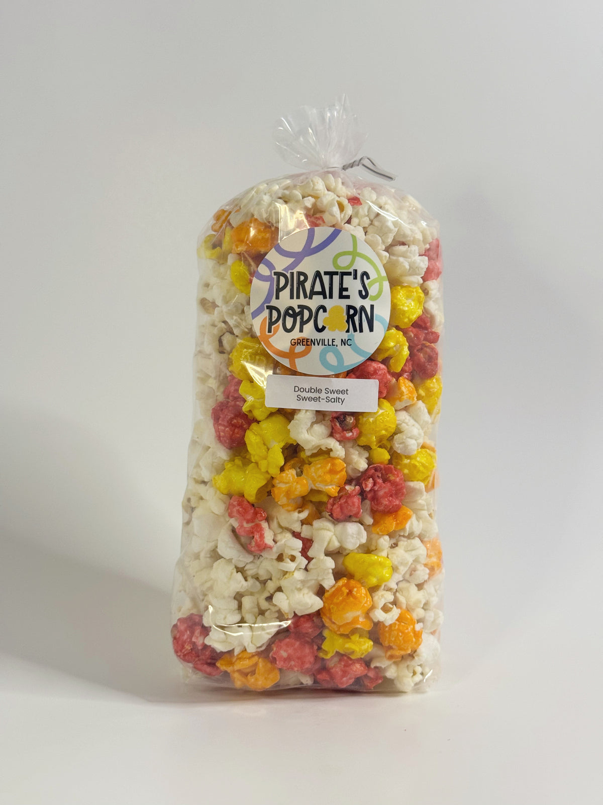 Bag of colorful popcorn with a 'Pirate's Popcorn' label on a white background gourmet popcorn gift bag