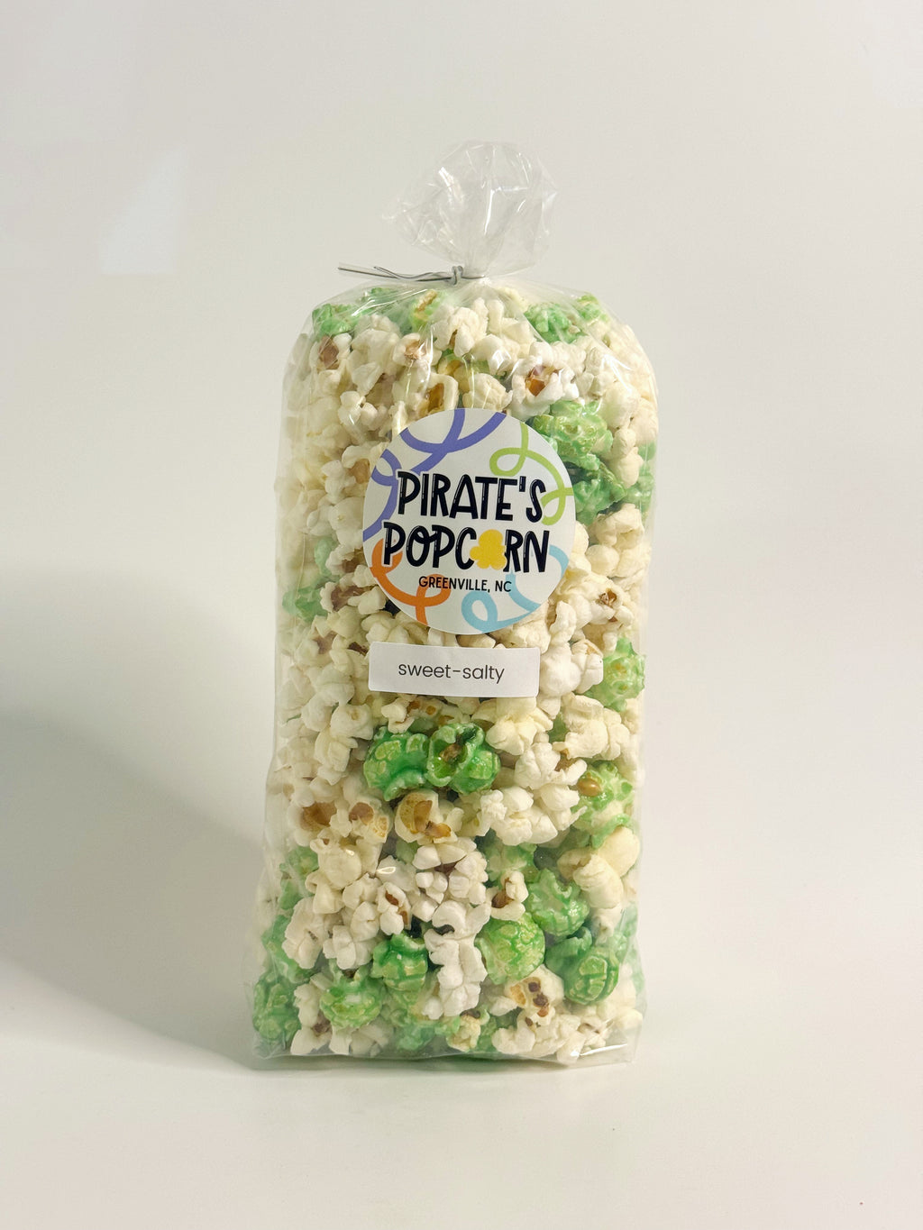 Bag of 'Pirate's Popcorn' with a label on a white background