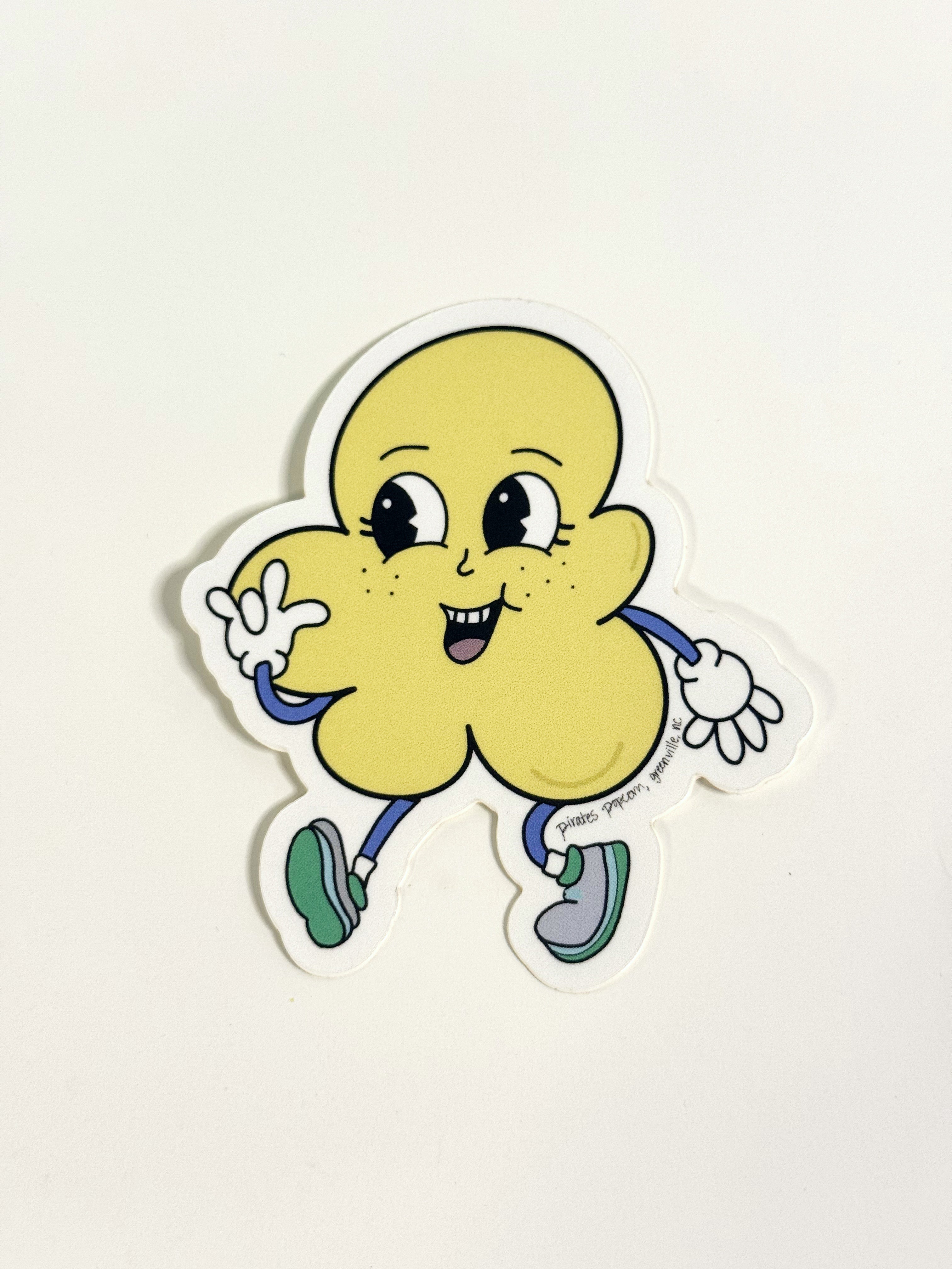 Cartoon character sticker of a yellow creature with a happy expression on a white background